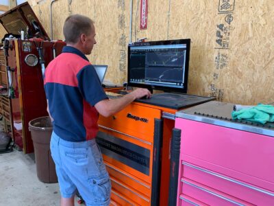Trinity Auto Service tech checking out the diagnostic readings on a computer screen